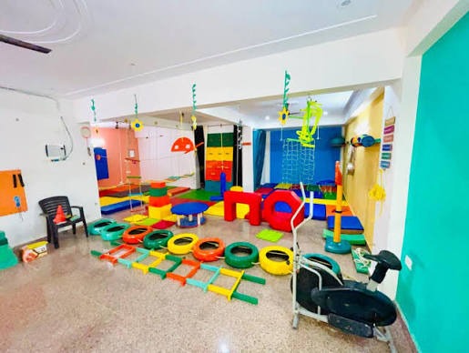 Colourful indoor sensory and therapy play gym with soft-play equipment